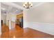 Open-concept featuring the kitchen and dining room with gorgeous hardwood floors and natural light at 1973 Cobblestone Cir, Brookhaven, GA 30319
