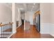 Hallway with hardwood floors leading to the kitchen and living room with a fireplace at 1973 Cobblestone Cir, Brookhaven, GA 30319