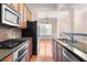 Kitchen featuring granite countertops, stainless steel appliances, and wooden cabinets at 1973 Cobblestone Cir, Brookhaven, GA 30319