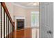 Living room with hardwood floors, a fireplace, and a door leading to the outdoor patio at 1973 Cobblestone Cir, Brookhaven, GA 30319