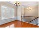 Living room with wood floors and large window at 1973 Cobblestone Cir, Brookhaven, GA 30319