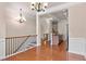 Open floor plan featuring the kitchen, dining room, and staircase with hardwood floors at 1973 Cobblestone Cir, Brookhaven, GA 30319