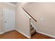 Foyer with hardwood floors, stairs with carpet runner and wooden banister at 1973 Cobblestone Cir, Brookhaven, GA 30319