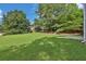 Lush backyard showcasing well-maintained lawn and mature trees, offering privacy at 1280 Chandler Ridge Dr, Lawrenceville, GA 30045
