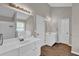 Bright bathroom with double sinks, a bathtub, and ample counter space at 1280 Chandler Ridge Dr, Lawrenceville, GA 30045