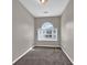 Bedroom featuring neutral walls, plush carpet, and a sunlit window at 1280 Chandler Ridge Dr, Lawrenceville, GA 30045