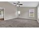 Spacious bedroom featuring neutral walls, plush carpeting, and natural lighting at 1280 Chandler Ridge Dr, Lawrenceville, GA 30045