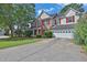 Charming two-story home with red shutters, brick accents, and a well-manicured lawn at 1280 Chandler Ridge Dr, Lawrenceville, GA 30045