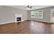 Inviting living room features a fireplace, ceiling fan, and large windows for natural light at 1280 Chandler Ridge Dr, Lawrenceville, GA 30045