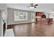 Open-concept living room with hardwood floors and a view of the kitchen area at 1280 Chandler Ridge Dr, Lawrenceville, GA 30045