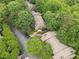 Overhead view of townhome community with lush trees and neighborhood parking at 2510 Cumberland Se Ct, Smyrna, GA 30080