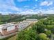 Aerial view of surrounding community with lush trees and commercial buildings in distance at 2510 Cumberland Se Ct, Smyrna, GA 30080