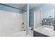 Bathroom features a shower and separate vanity with glass tiling at 2510 Cumberland Se Ct, Smyrna, GA 30080
