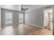 Spacious bedroom featuring hardwood floors, two windows, and a ceiling fan at 2510 Cumberland Se Ct, Smyrna, GA 30080