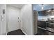 Entryway leading into a kitchen with dark cabinets and stainless steel appliances at 2510 Cumberland Se Ct, Smyrna, GA 30080