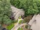 Aerial view of charming two-story townhomes surrounded by lush green trees at 2510 Cumberland Se Ct, Smyrna, GA 30080