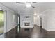 Cozy living room with fireplace, ceiling fan, and sliding door to outdoor space at 2510 Cumberland Se Ct, Smyrna, GA 30080