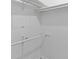 Walk-in closet with white shelving and hanging bars for storage at 2510 Cumberland Se Ct, Smyrna, GA 30080