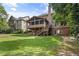 Large backyard with a screened-in porch is perfect for entertaining and enjoying the outdoors at 4840 Spring Park Cir, Suwanee, GA 30024