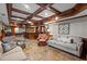 Finished basement featuring tile flooring, a bar, and comfortable seating for gatherings at 4840 Spring Park Cir, Suwanee, GA 30024
