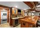 Basement bar with custom wood cabinets, granite countertop and TV at 4840 Spring Park Cir, Suwanee, GA 30024