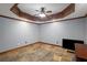 Finished basement with tray ceiling, and a flat screen TV at 4840 Spring Park Cir, Suwanee, GA 30024