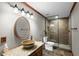 Bathroom featuring a stylish vanity with copper sink and luxurious glass shower at 4840 Spring Park Cir, Suwanee, GA 30024