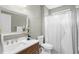Updated bathroom boasts a modern vanity, toilet, and a shower with a stylish curtain at 4840 Spring Park Cir, Suwanee, GA 30024