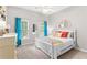 Bright bedroom featuring a bed with colorful pillows and matching curtains and decor at 4840 Spring Park Cir, Suwanee, GA 30024