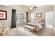Comfortable bedroom featuring a bed, ceiling fan, and natural light at 4840 Spring Park Cir, Suwanee, GA 30024