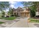 Attractive two-story home with a basketball hoop, three-car garage, and a beautifully landscaped front yard at 4840 Spring Park Cir, Suwanee, GA 30024