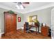 Well-appointed office space with hardwood floors, built-in cabinetry, and a ceiling fan for added comfort at 4840 Spring Park Cir, Suwanee, GA 30024