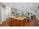 Modern kitchen with a central island, wood cabinets, stainless steel appliances, and an open layout at 4840 Spring Park Cir, Suwanee, GA 30024