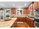 Stylish kitchen featuring granite countertops, stainless steel appliances, and ample cabinet space at 4840 Spring Park Cir, Suwanee, GA 30024