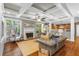 Inviting living room with fireplace, coffered ceilings, hardwood floors, and open access to the kitchen at 4840 Spring Park Cir, Suwanee, GA 30024