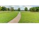 Scenic walking path winds through green spaces, inviting residents to enjoy nature and exercise at 4840 Spring Park Cir, Suwanee, GA 30024