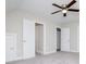 Neutral-toned bedroom featuring a ceiling fan, carpet, and multiple closets at 5995 Azalea Ridge Dr, Douglasville, GA 30135