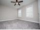 An empty bedroom with two windows and a ceiling fan at 5995 Azalea Ridge Dr, Douglasville, GA 30135