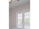 Bright bedroom featuring French doors, creating a peaceful retreat with ample natural light at 5995 Azalea Ridge Dr, Douglasville, GA 30135