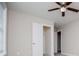 Neutral bedroom featuring a ceiling fan and white door, offering a clean and inviting space at 5995 Azalea Ridge Dr, Douglasville, GA 30135