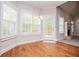 Cozy breakfast nook with hardwood floors, bright windows and a fireplace view at 5995 Azalea Ridge Dr, Douglasville, GA 30135