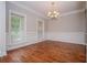 Formal dining room with hardwood floors, wainscoting, and a classic chandelier at 5995 Azalea Ridge Dr, Douglasville, GA 30135