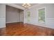 Spacious dining room featuring hardwood floors, large windows and a stylish chandelier at 5995 Azalea Ridge Dr, Douglasville, GA 30135