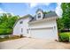 Charming two-story home with a two-car garage and manicured landscaping at 5995 Azalea Ridge Dr, Douglasville, GA 30135
