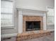 Brick fireplace with a white mantel, flanked by windows, in a cozy living space at 5995 Azalea Ridge Dr, Douglasville, GA 30135