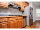 Kitchen features gas range, stainless steel refrigerator and wood cabinets at 5995 Azalea Ridge Dr, Douglasville, GA 30135