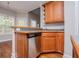Kitchen area with a stainless steel dishwasher and a dining area at 5995 Azalea Ridge Dr, Douglasville, GA 30135