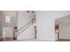 Open-concept living area with soaring ceilings, staircase, and hardwood floors leading to the kitchen at 5995 Azalea Ridge Dr, Douglasville, GA 30135