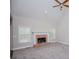 Comfortable living room featuring a brick fireplace, carpeted floors and a ceiling fan at 5995 Azalea Ridge Dr, Douglasville, GA 30135
