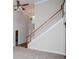Spacious living room with a staircase, neutral carpet, and abundant natural light at 5995 Azalea Ridge Dr, Douglasville, GA 30135